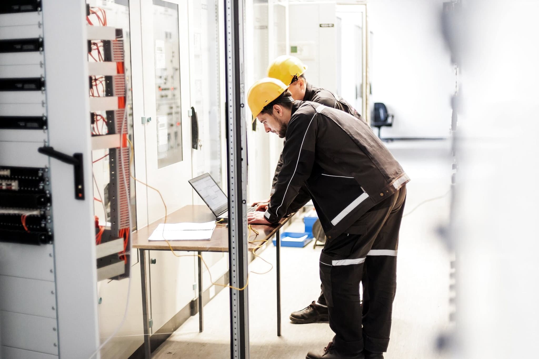 Engineers commissioning switchgear